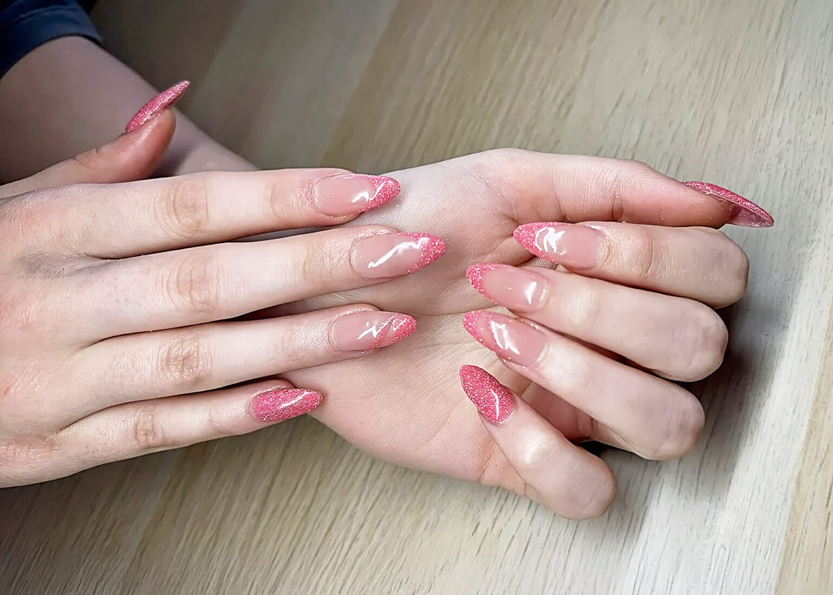 Pink glitter Gel X nail extensions in almond shape